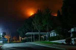 wildfire threatening a home